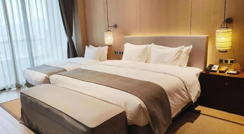 Bed in Jolie Vue Boutique Hotel Sanjiang