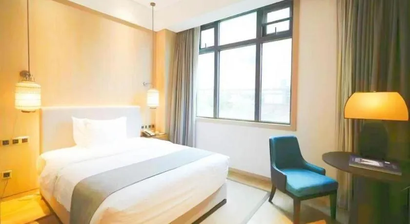 Bed in Jolie Vue Boutique Hotel Sanjiang