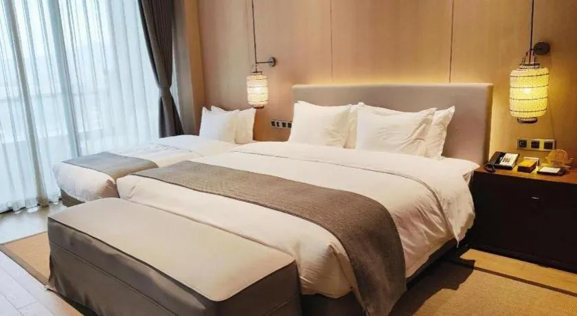 Bed in Jolie Vue Boutique Hotel Sanjiang