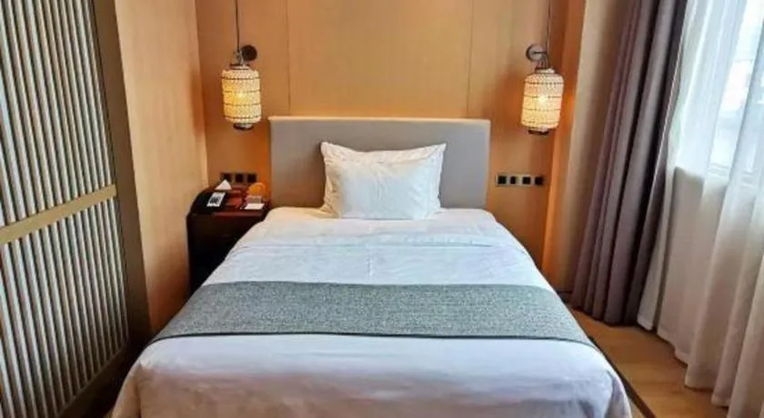 Bed in Jolie Vue Boutique Hotel Sanjiang