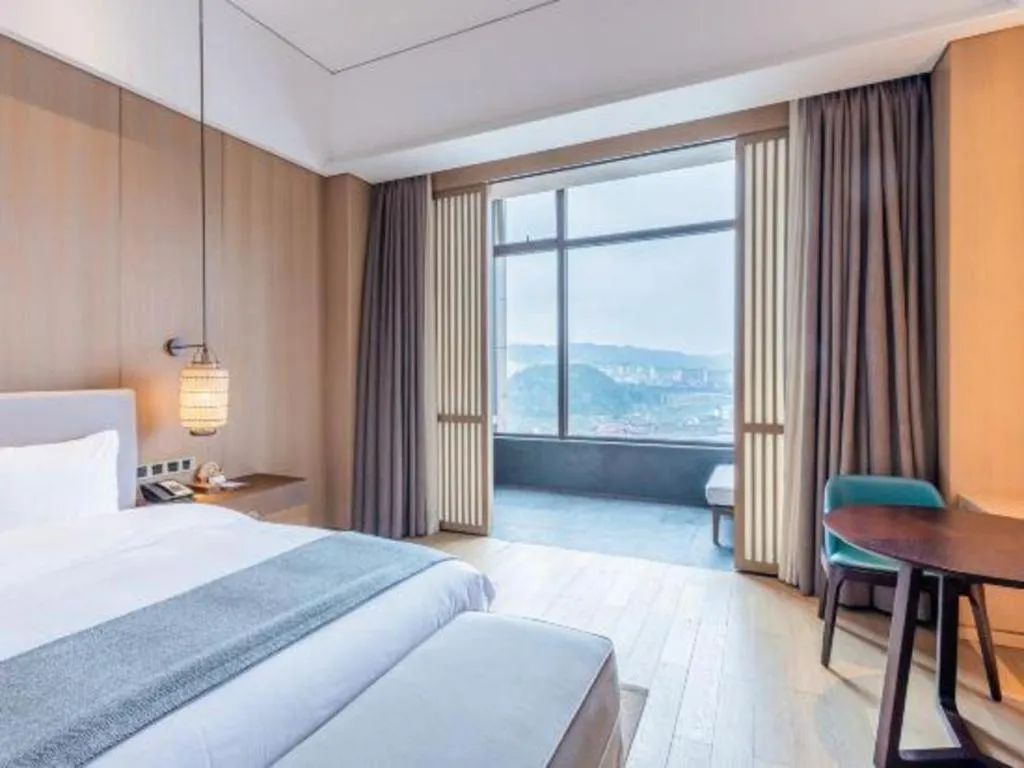 Bed in Jolie Vue Boutique Hotel Sanjiang
