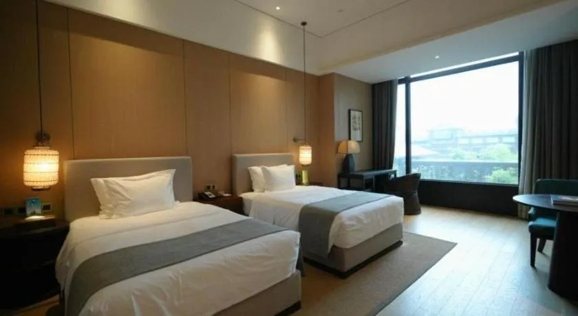 Bed in Jolie Vue Boutique Hotel Sanjiang