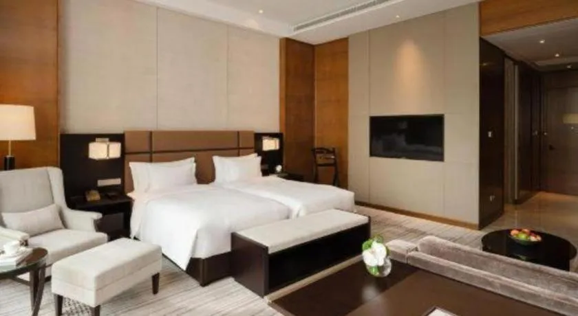 Bed in Fortune Grove Hotel Beijing