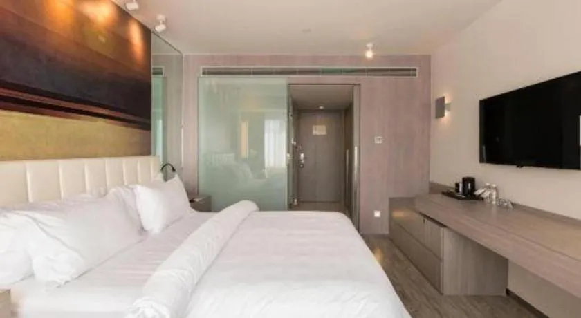 Bed in Jinjiang Metropolo Shanghai Xujiahui Nanhuating Hotel