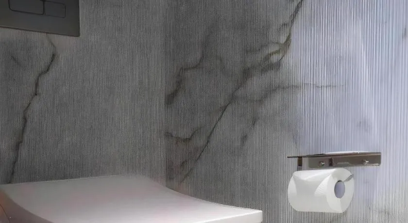 Bed in Jinjiang Metropolo Shanghai Xujiahui Nanhuating Hotel