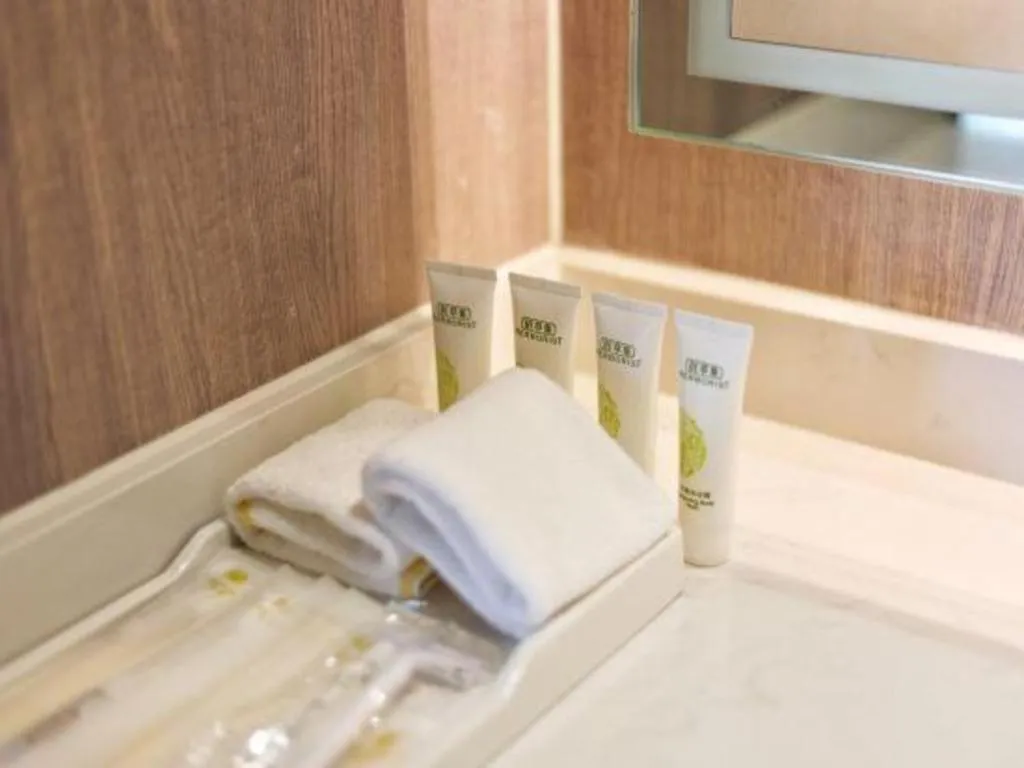 Bed in Jinjiang Metropolo Shanghai Xujiahui Nanhuating Hotel