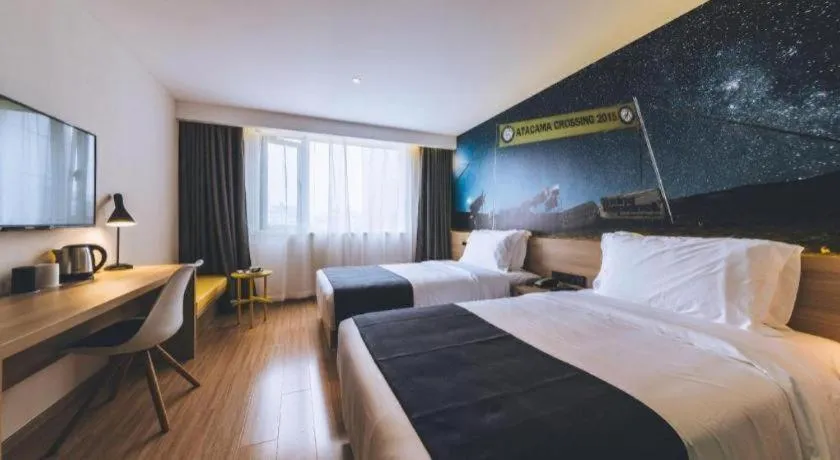 Bed in Ibis Styles Shanghai Qingpu Sports Center Hotel