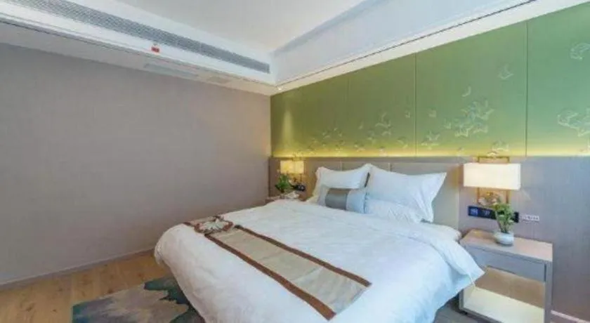 Bed in GreenTree Eastern Dali Railway Station Hotel