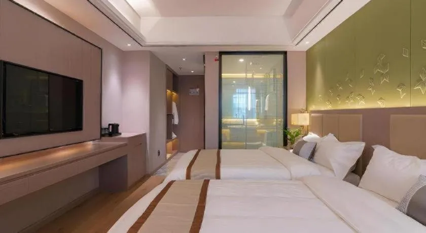 Bed in GreenTree Eastern Dali Railway Station Hotel