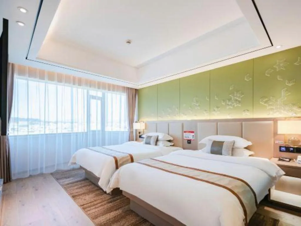 Bed in GreenTree Eastern Dali Railway Station Hotel