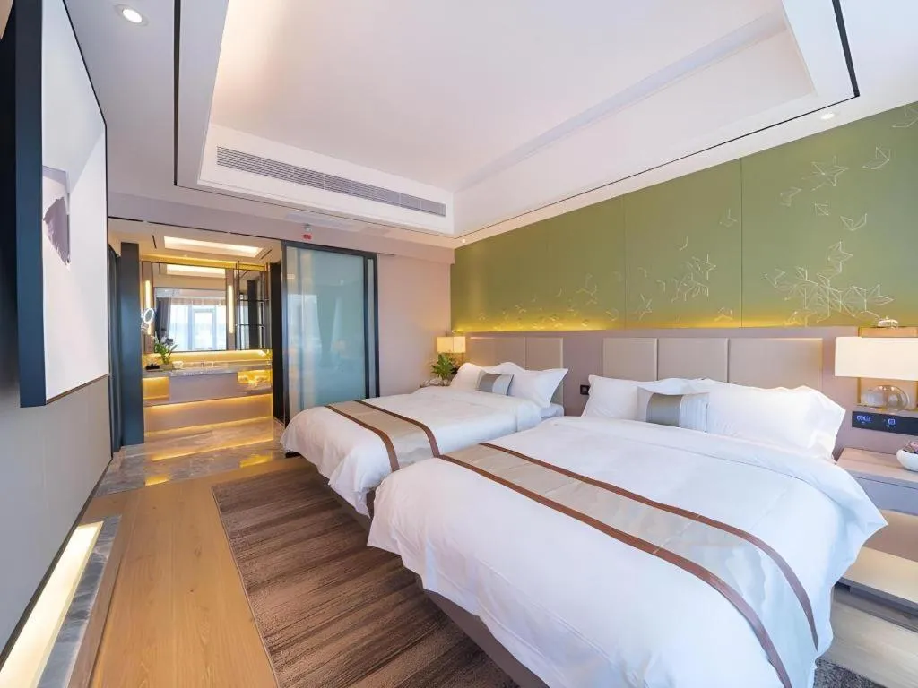 Bed in GreenTree Eastern Dali Railway Station Hotel