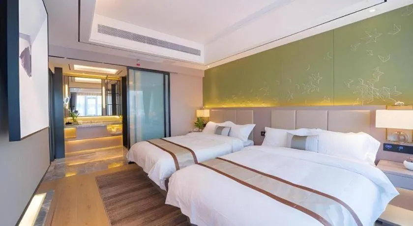 Bed in GreenTree Eastern Dali Railway Station Hotel