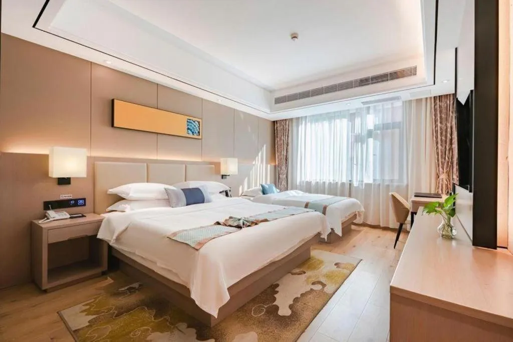 Bed in GreenTree Eastern Dali Railway Station Hotel