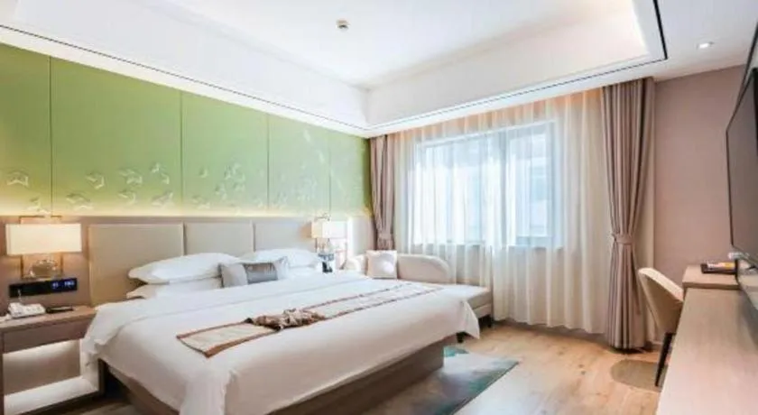 Bed in GreenTree Eastern Dali Railway Station Hotel