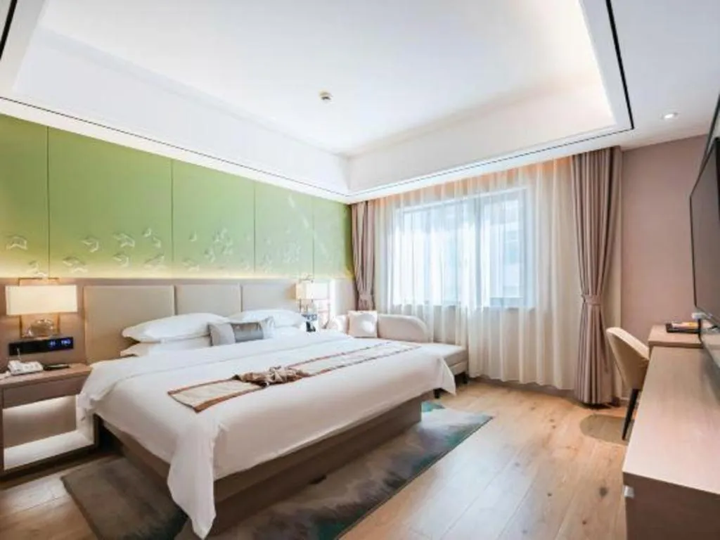 Bed in GreenTree Eastern Dali Railway Station Hotel