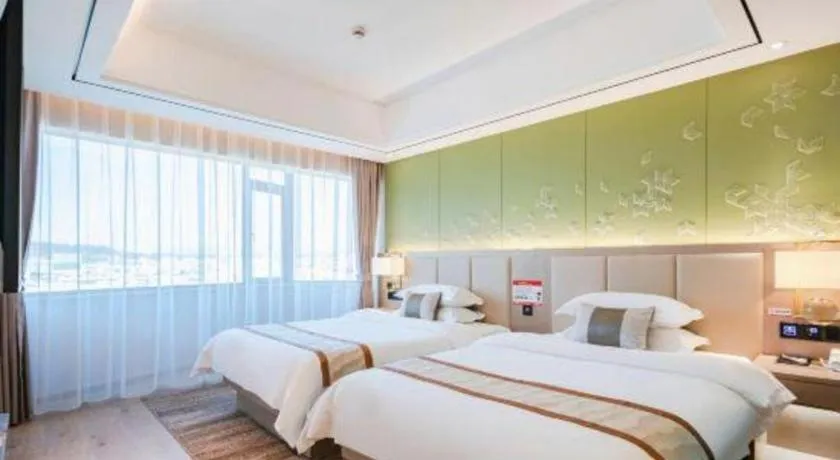 Bed in GreenTree Eastern Dali Railway Station Hotel