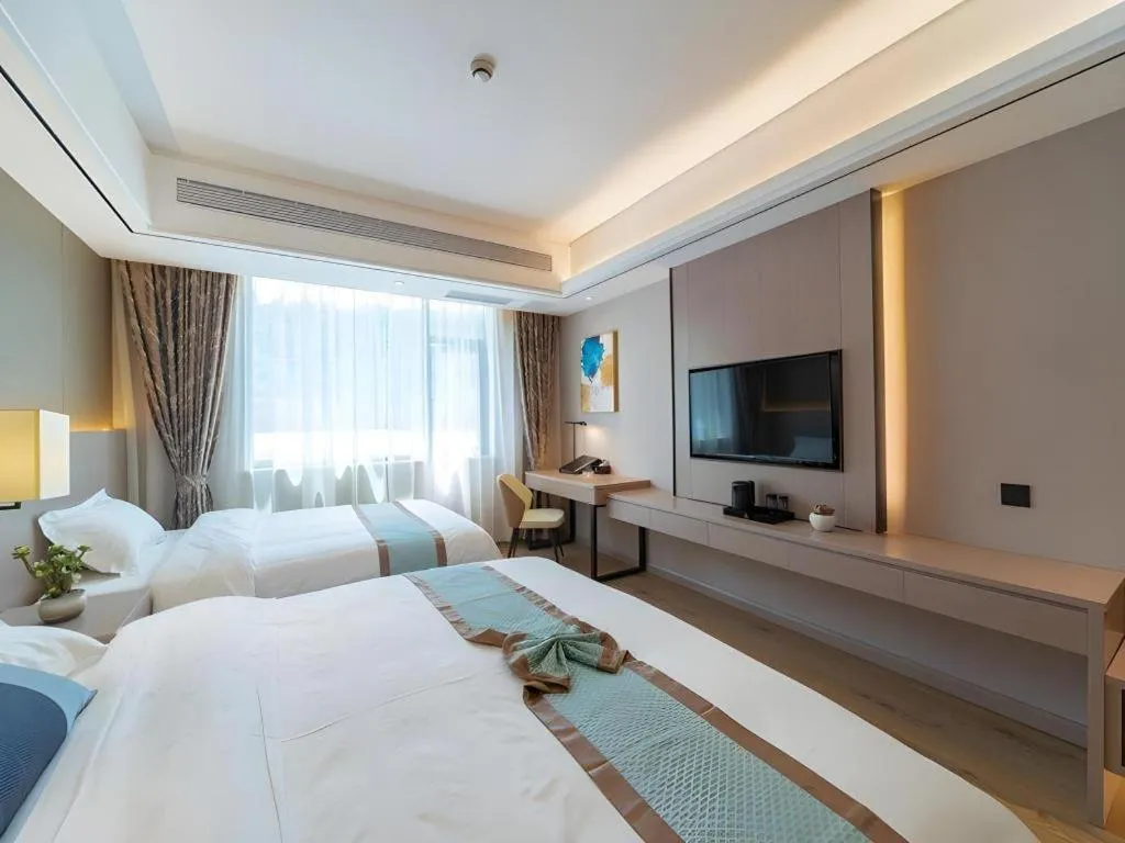 Bed in GreenTree Eastern Dali Railway Station Hotel