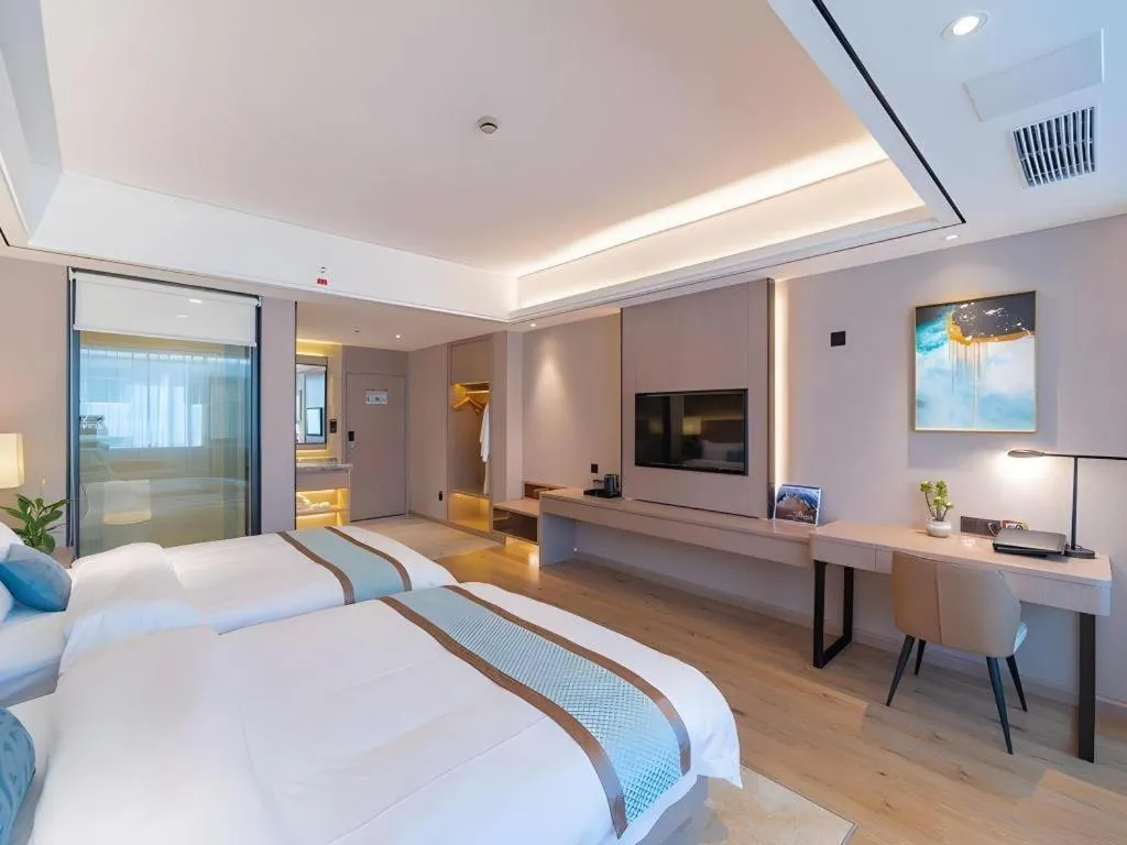 Bed in GreenTree Eastern Dali Railway Station Hotel