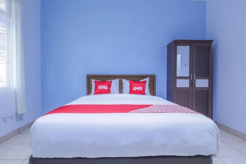 Bed in OYO 1755 De'balcon Accomodation Near Ngurah Rai Airport