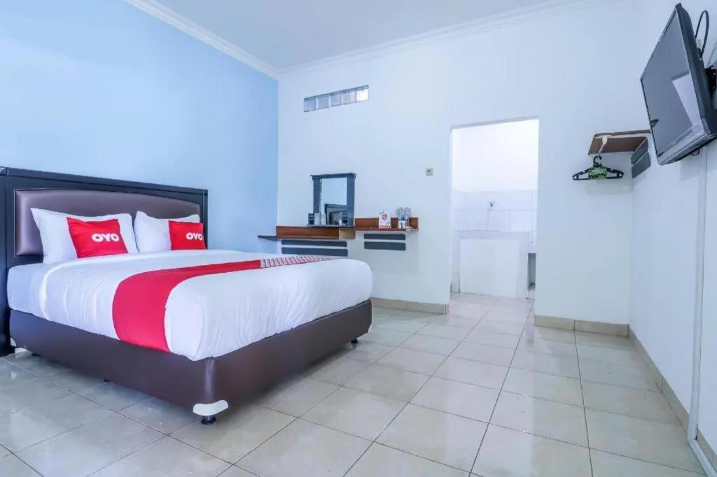 Bed in OYO 1755 De'balcon Accomodation Near Ngurah Rai Airport