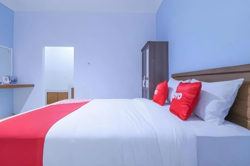 Bed in OYO 1755 De'balcon Accomodation Near Ngurah Rai Airport