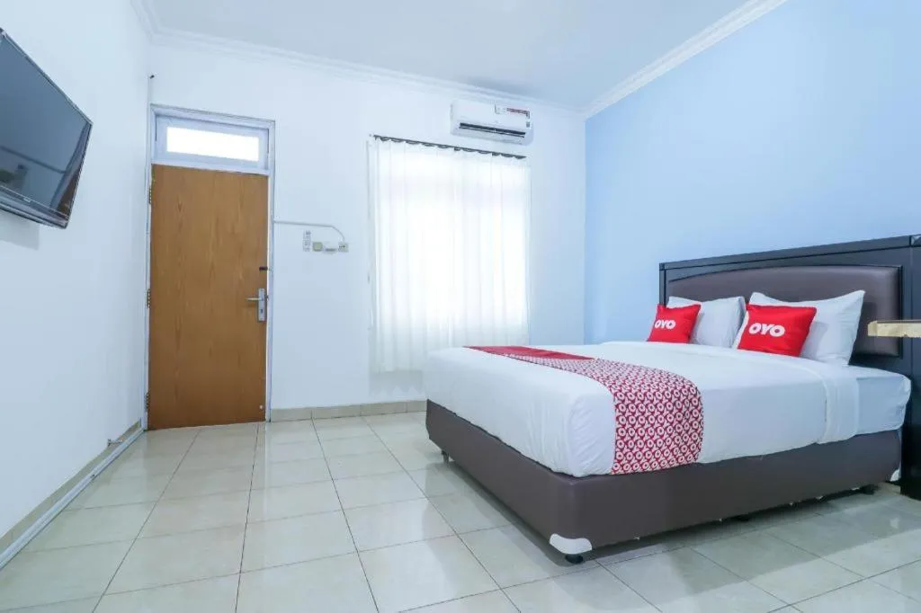 Bed in OYO 1755 De'balcon Accomodation Near Ngurah Rai Airport