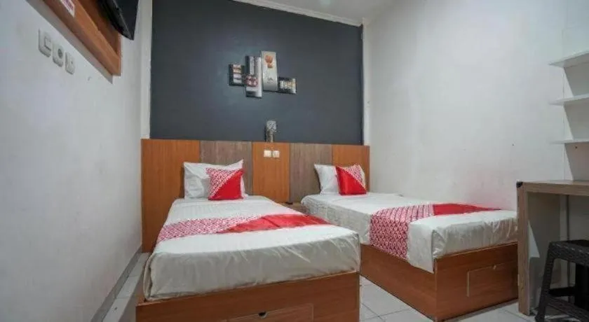 Bed in Hotel O Green Palm Kostel Syariah