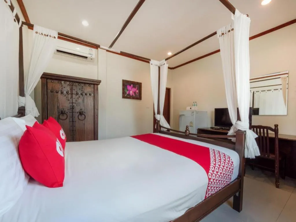Bed in OYO 1131 Rendezvous Resort & Restaurant