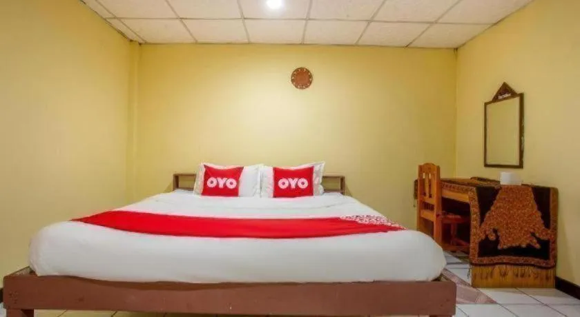 Bed in OYO 1000 Maetang Hotel