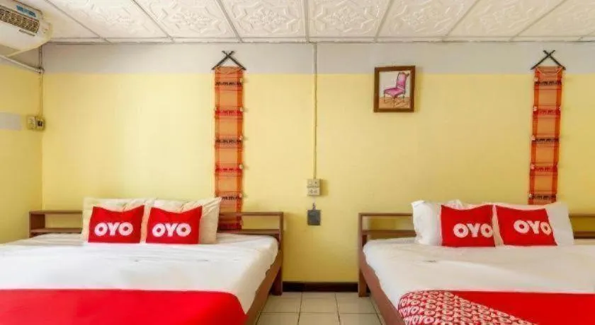 Bed in OYO 1000 Maetang Hotel