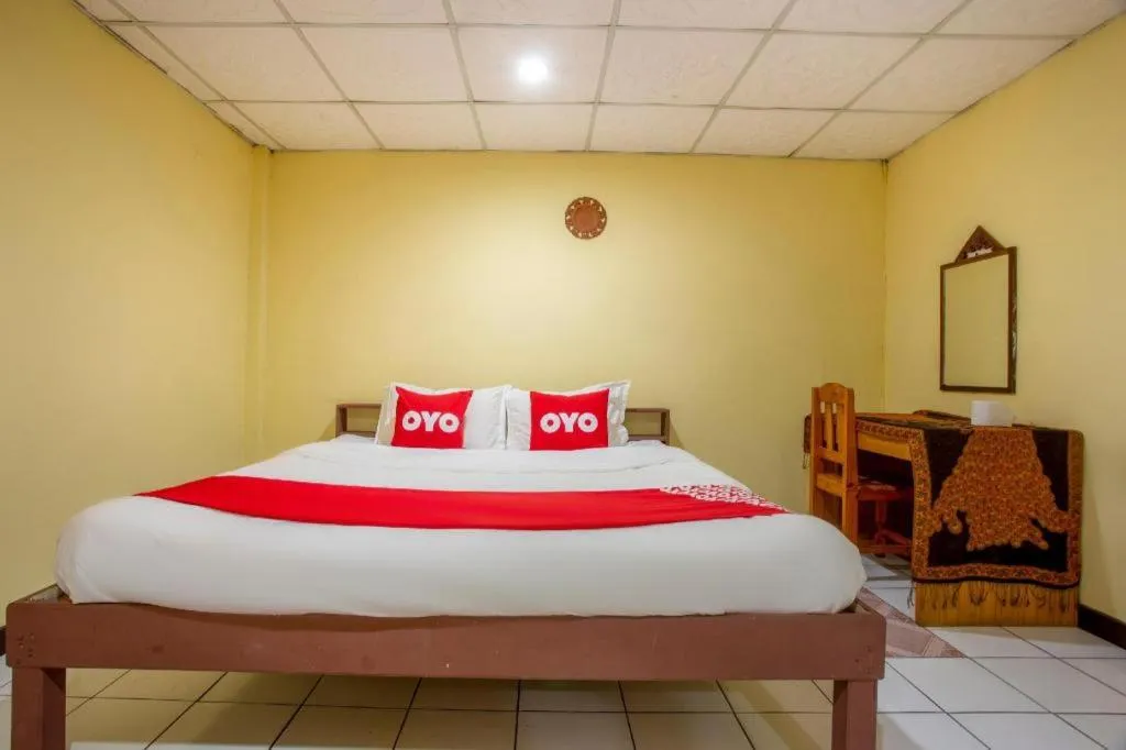 Bed in OYO 1000 Maetang Hotel