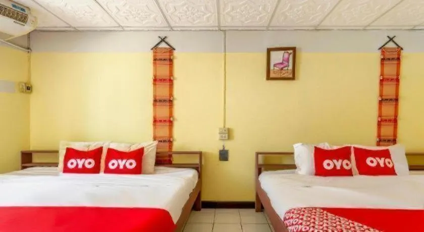 Bed in OYO 1000 Maetang Hotel