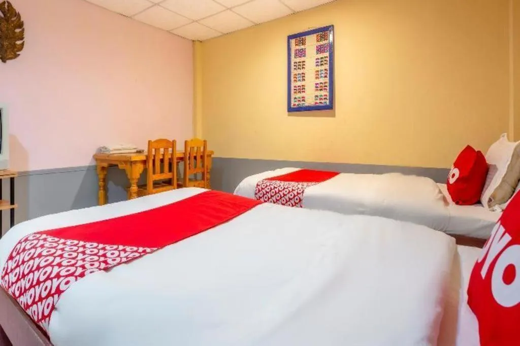 Bed in OYO 1000 Maetang Hotel