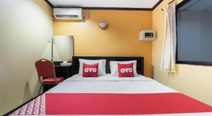 Bed in OYO 75327 Diyana Residence