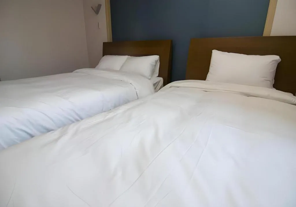 Bed in Hyundai Elliot Hotel and Resort