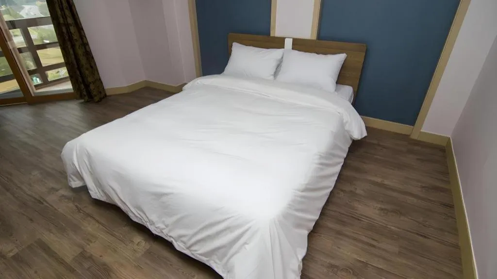 Bed in Hyundai Elliot Hotel and Resort