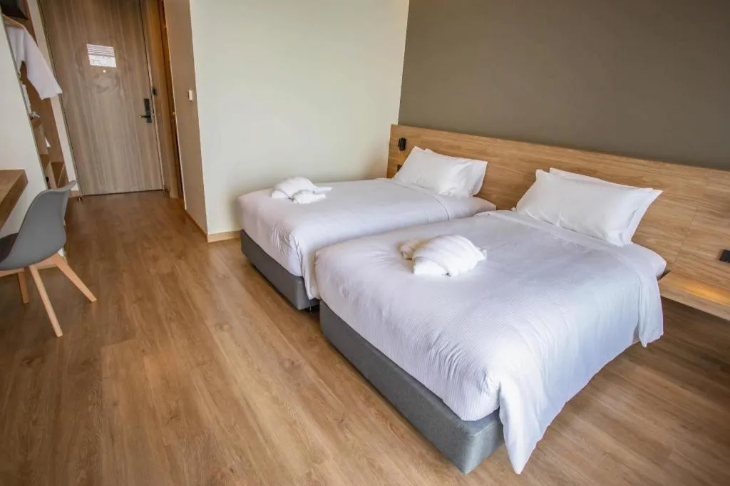 Bed in Chewa Khong Hotel Nakhon Phanom