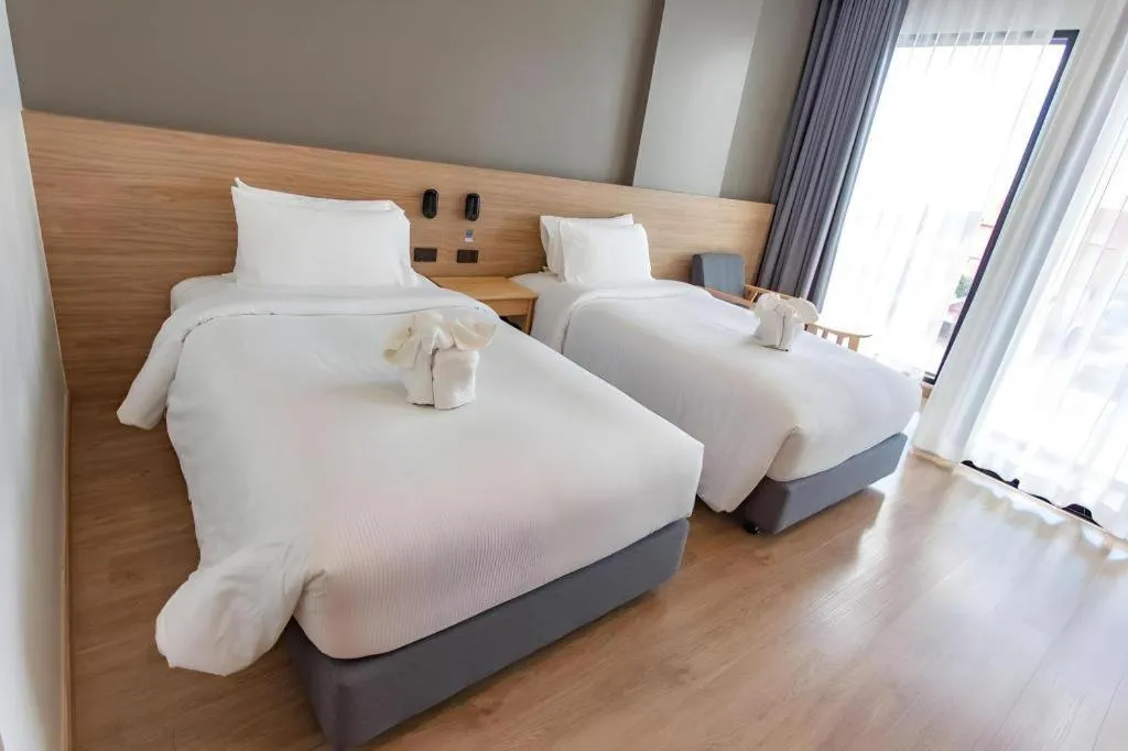 Bed in Chewa Khong Hotel Nakhon Phanom