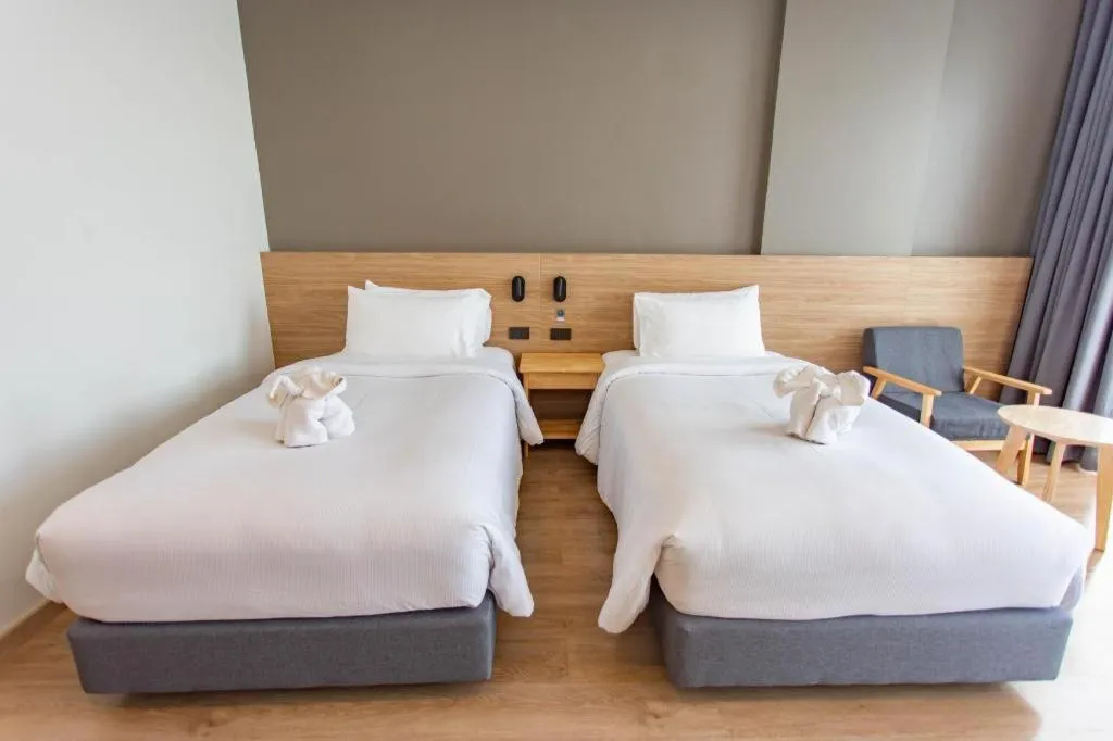 Bed in Chewa Khong Hotel Nakhon Phanom