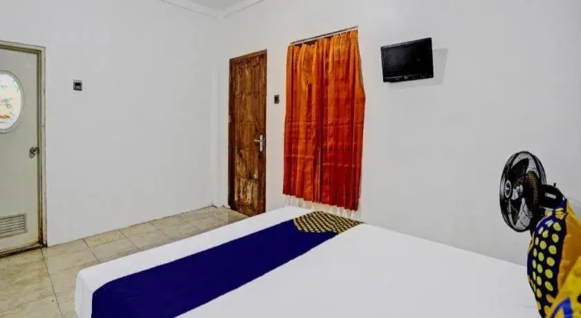 Bed in Hotel O Griya Sandi Residence Family NearPantai Boom Bed in Hotel O Griya Sandi Residence Family NearPantai Boom