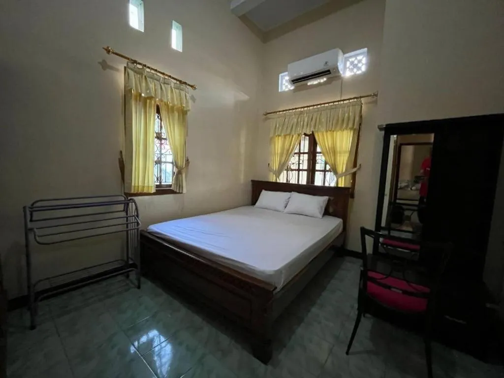 Bed in OYO 94003 Anjuk Ladang Homestay