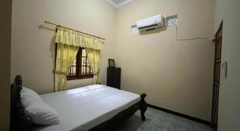 Bed in OYO 94003 Anjuk Ladang Homestay