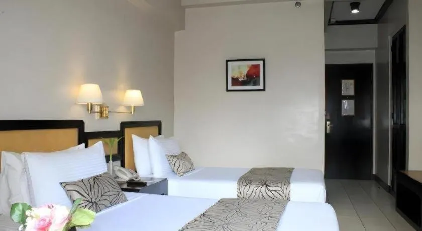 Bed in Palm Hotel Manila