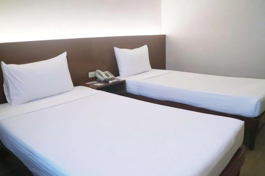 Bed in Palm Hotel Manila