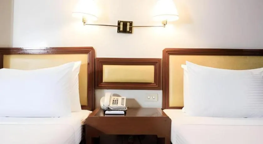 Bed in Palm Hotel Manila