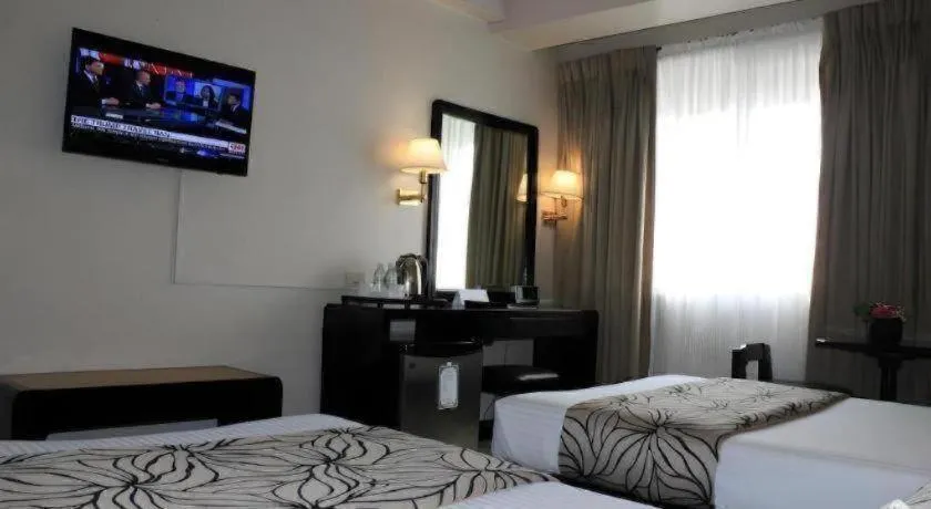 Bed in Palm Hotel Manila