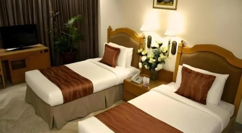 Bed in Palm Hotel Manila