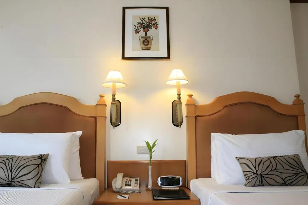 Bed in Palm Hotel Manila