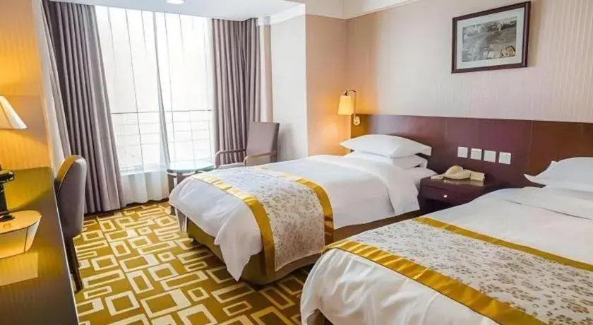 Bed in Dong Fang Hotel Bed in Dong Fang Hotel