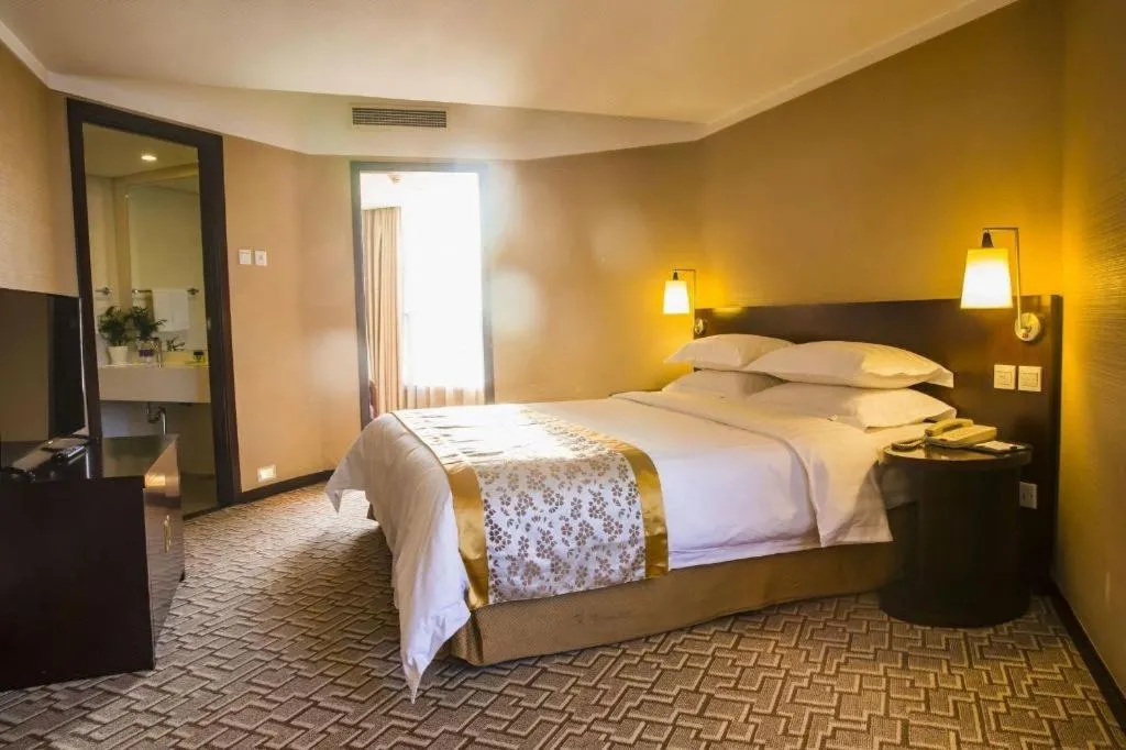 Bed in Dong Fang Hotel